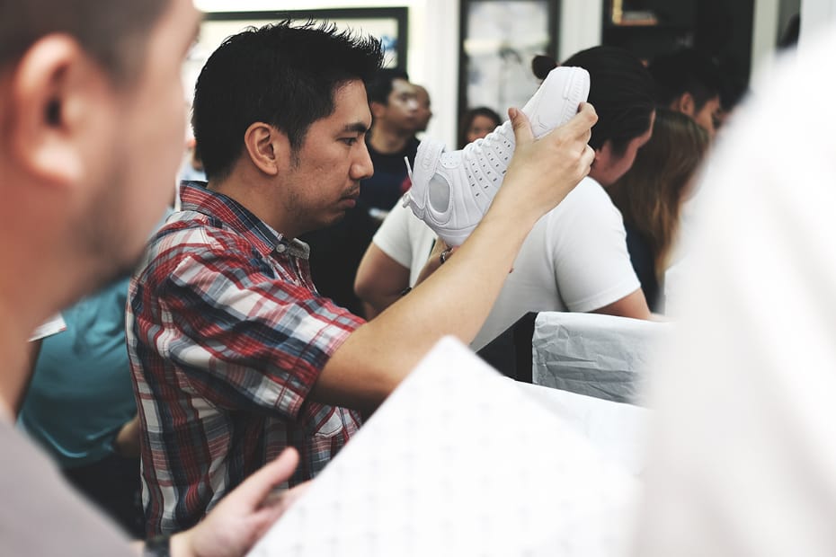 A photo of a man checking out a product